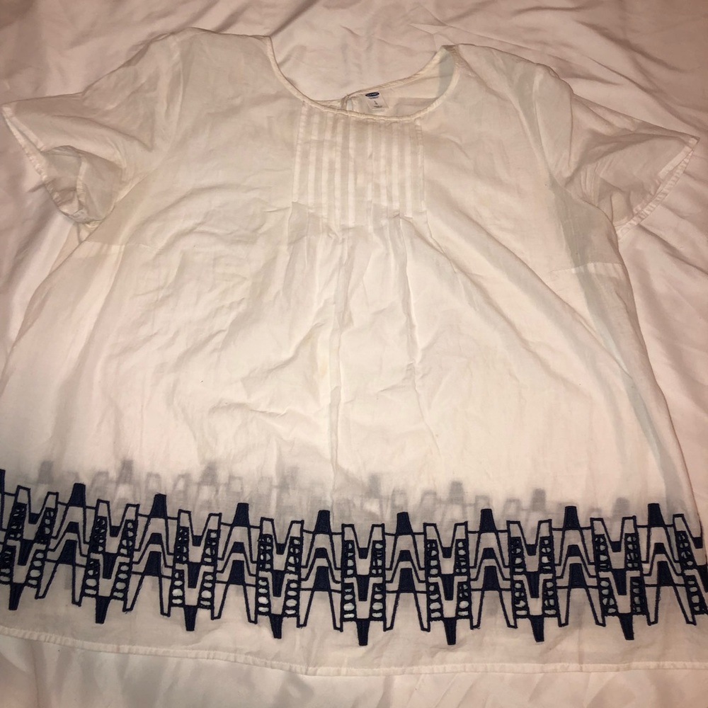 White top with blue detail